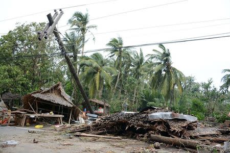 Damaged houses and debris are seen after strong winds and heavy rains brought by typhoon Melor battered Gubat town, Sorsogon province, central Philippines December 15, 2015. REUTERS/Renelyn Loquinario