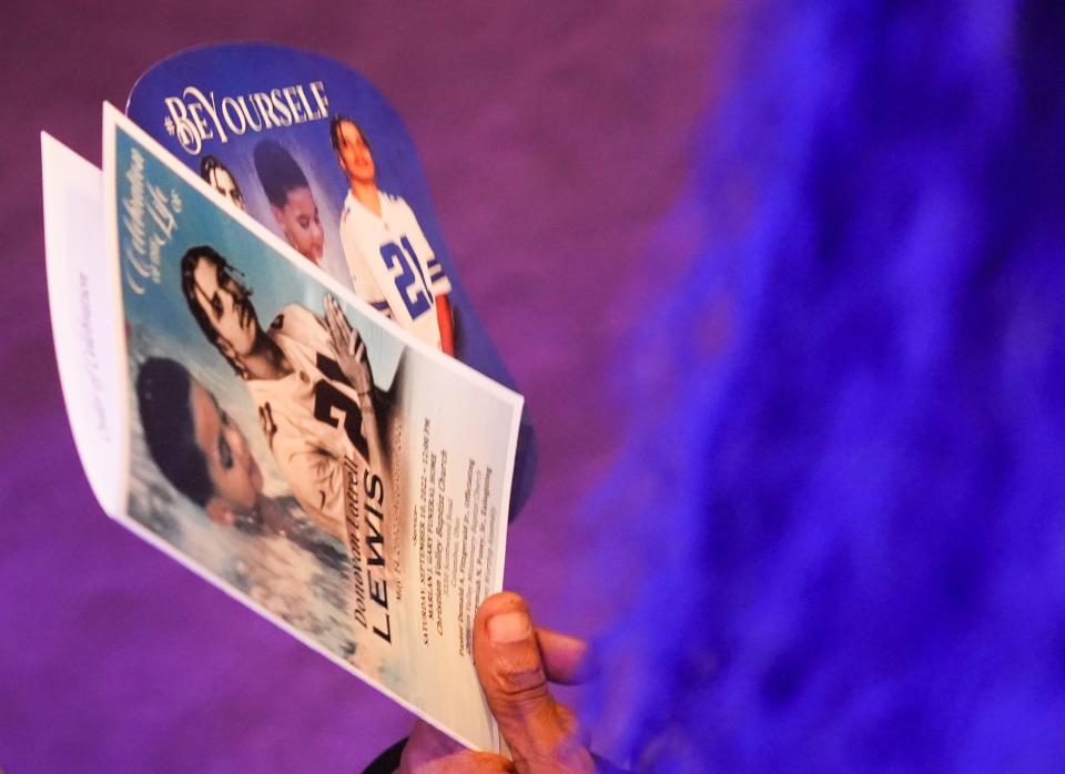 Sep 10, 2022; Columbus, OH, United States; A visitor holds a program during the funeral service for Donovan Lewis who was fatally shot by Columbus police officer Ricky Anderson on Aug. 30, 2022.  Mandatory Credit: Brooke LaValley-The Columbus Dispatch