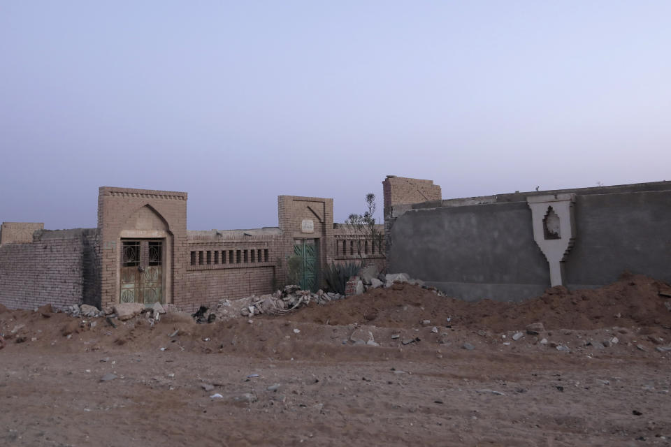 The entrance to the public graveyard where ex-president Mohammed Morsi was buried, is cordoned off, in a suburb of Cairo, Egypt, early Tuesday, June 18, 2019. Morsi, Egypt's first democratically elected president, was buried under heavy security early on Tuesday, a day after his dramatic collapse and death inside a Cairo courtroom. No media coverage was allowed. (AP Photo/Nariman El-Mofty)