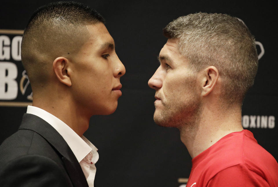 Jaime Munguia, left, and Liam Smith pose for photographers during a news conference Thursday, July 19, 2018, in Las Vegas. (AP)