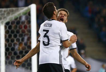 Football Soccer - Germany v Czech Republic - 2018 World Cup Qualifying European Zone - Group C - Hamburg arena, Hamburg, Germany - 8/10/16 Germany's Jonas Hector and Thomas Mueller react REUTERS/Wolfgang Rattay