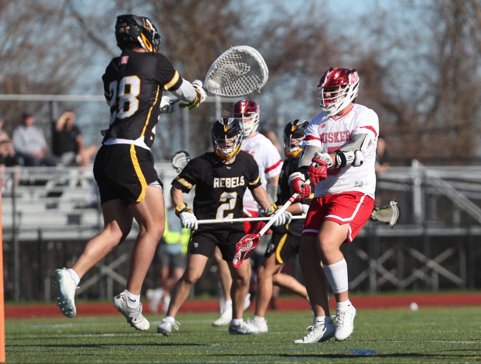 Somers Grayden Carr (5) fires a shot in front of Lakeland/Panas Kevin Bryan (28) during boys lacrosse action at Somers High School April 16. 2024. Somers won the game10-5.