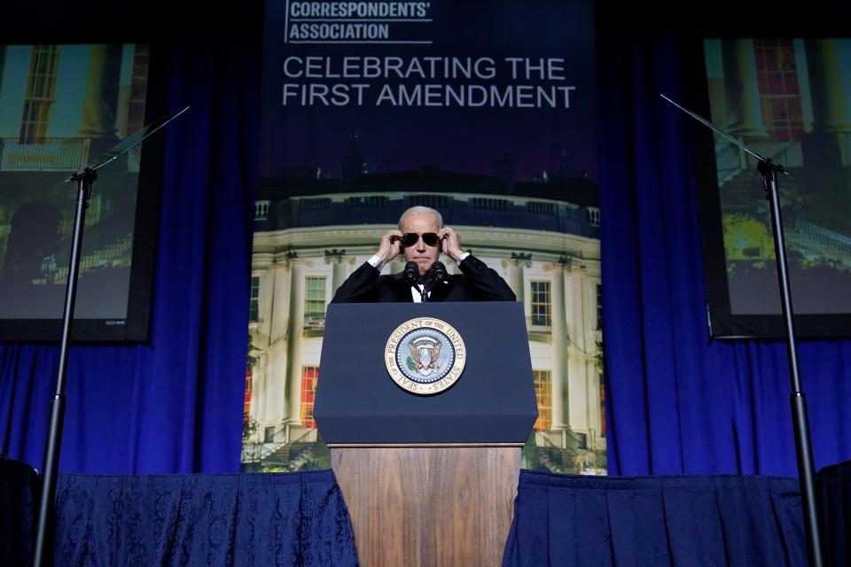 President Joe Biden puts on sunglasses after making a joke about becoming the "Dark Brandon" persona during the White House Correspondents' Association dinner at the Washington Hilton in Washington, Saturday, April 29, 2023.