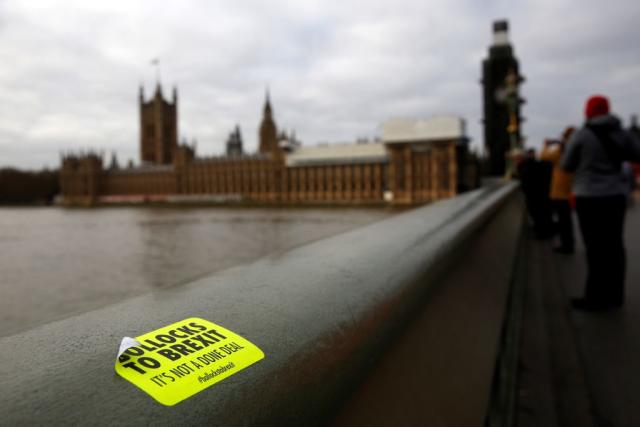 Police called to Westminster Bridge as protestor balances on ledge