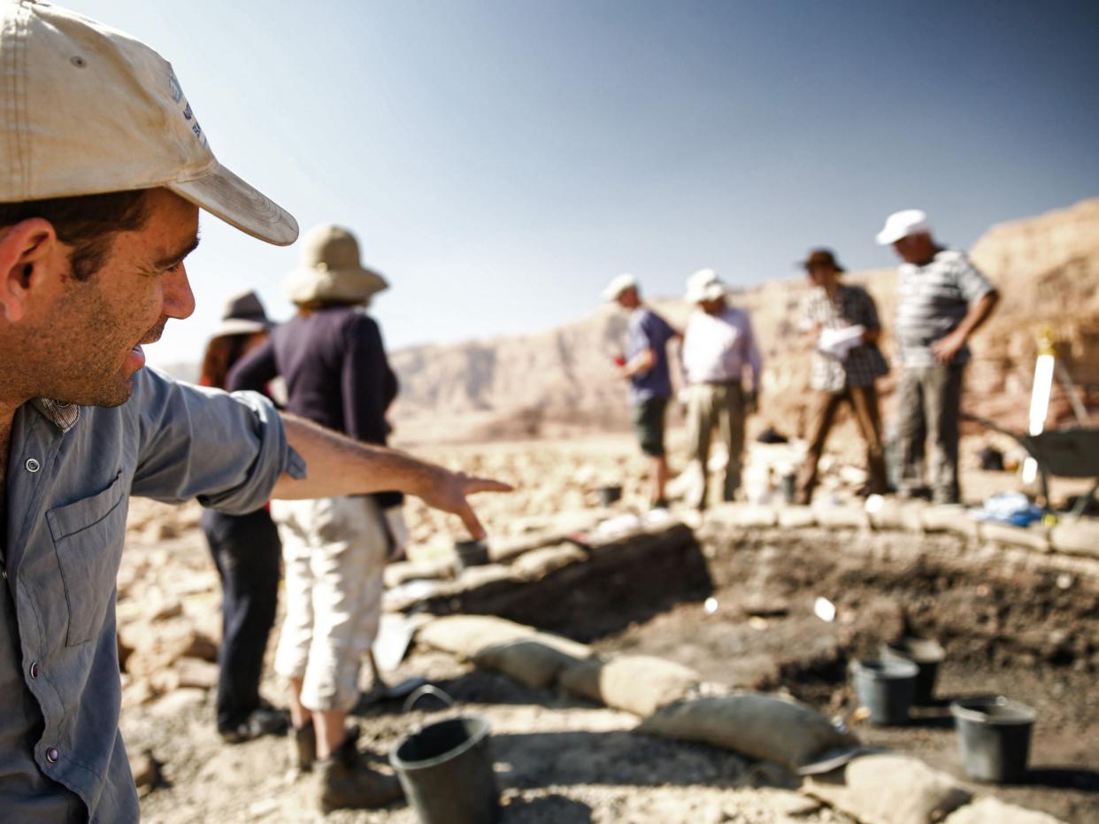 <p>Archaeologists working in the field in the Timna Valley, an ancient copper mine, have discovered purple-dyed fabric</p> (Israeli Antiquities Authority/AFP via Getty Images)