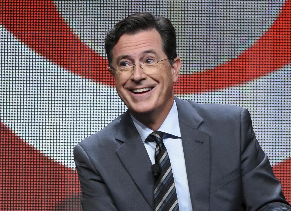 FILE - In this Aug. 10, 2015 file photo, Stephen Colbert participates in the "The Late Show with Stephen Colbert" segment of the CBS Summer TCA Tour in Beverly Hills, Calif. Colbert will host the annual Emmy Awards telecast, this year to be shown on his home network of CBS on Sept. 17, in Los Angeles. (Photo by Richard Shotwell/Invision/AP, File)