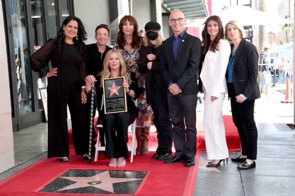 Chair of the Hollywood Chamber of Commerce Lupita Sanchez Cornejo, David Faustino, Christina Applegate, Katey Sagal, Sadie Grace LeNoble, Mitch O'Farrell, Linda Cardellini, and Liz Feldman pose with Christina Applegate's star during her Hollywood Walk of 