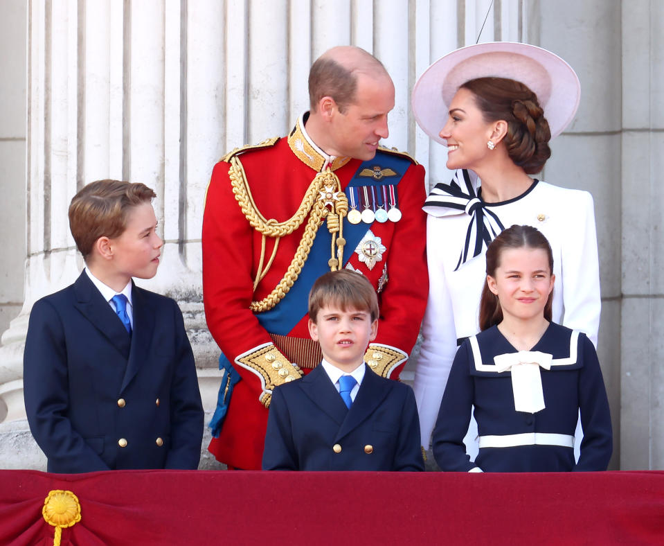 LONDON, ENGLAND - JUNE 15: (L-R) Prince George of Wales, Prince William, Prince of Wales, Prince Louis of Wales, Catherine, Princess of Wales and Princess Charlotte of Wales on the balcony during Trooping the Colour at Buckingham Palace on June 15, 2024 in London, England. Trooping the Colour is a ceremonial parade celebrating the official birthday of the British Monarch. The event features over 1,400 soldiers and officers, accompanied by 200 horses. More than 400 musicians from ten different bands and Corps of Drums march and perform in perfect harmony. (Photo by Chris Jackson/Getty Images)