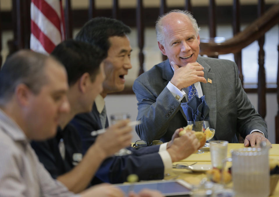 In this Oct. 2, 2018 photo, Rep. Dan Donovan, R-NY, talks to members of the Rotary Club in Staten Island borough of New York. Donovan's Democratic Challenger in the 2018 mid-term election is Max Rose, an Army veteran who has positioned himself as a moderate. (AP Photo/Seth Wenig)