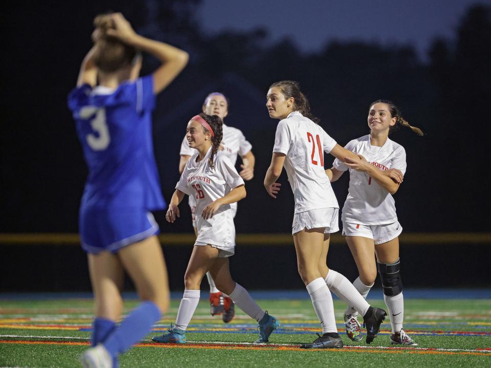 Members of the Portsmouth girls soccer team celebrate a goal Tuesday night against Middletown.