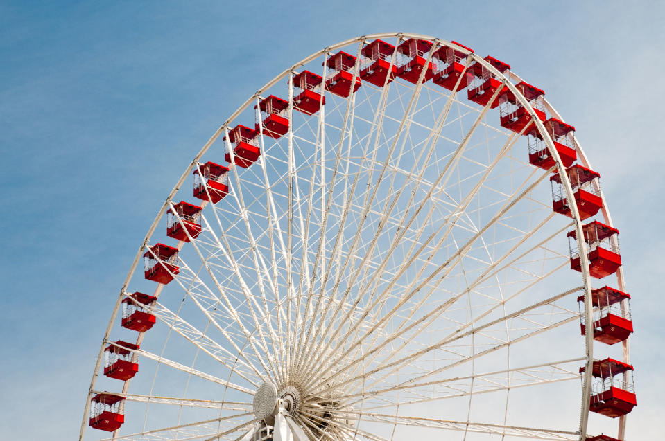 Ferris wheel against blue sky (Flash Parker / Getty Images)