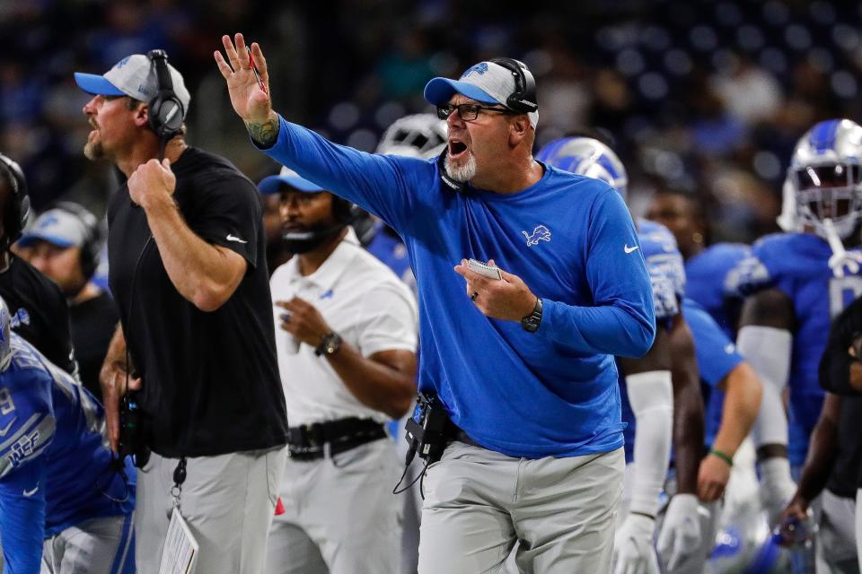 Detroit Lions defensive line coach Todd Wash signals players during the second half of a preseason game at Ford Field in Detroit on Friday, Aug. 27, 2021.