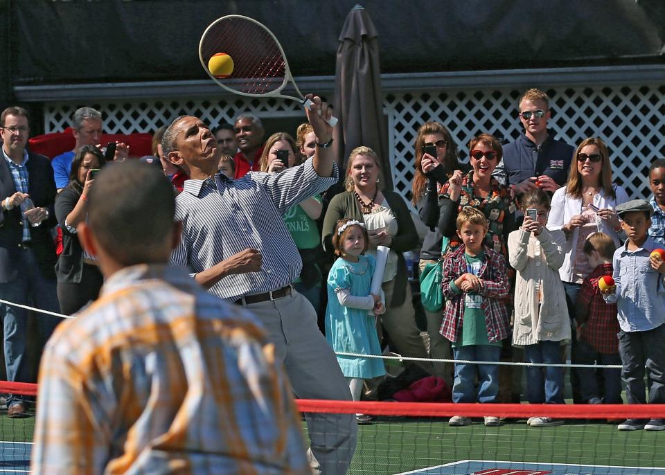 Barack Obama playing on the White House tennis court in 2013Getty Images
