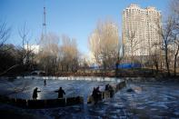 The Wider Image: On a frozen pond far from the Olympics, meet China's ice hockey veterans