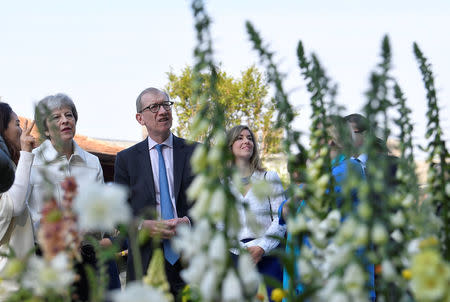 Britain's Prime Minister, Theresa May, and her husband Philip visit the RHS Chelsea Flower Show in London, Britain May 21, 2018. REUTERS/Toby Melville