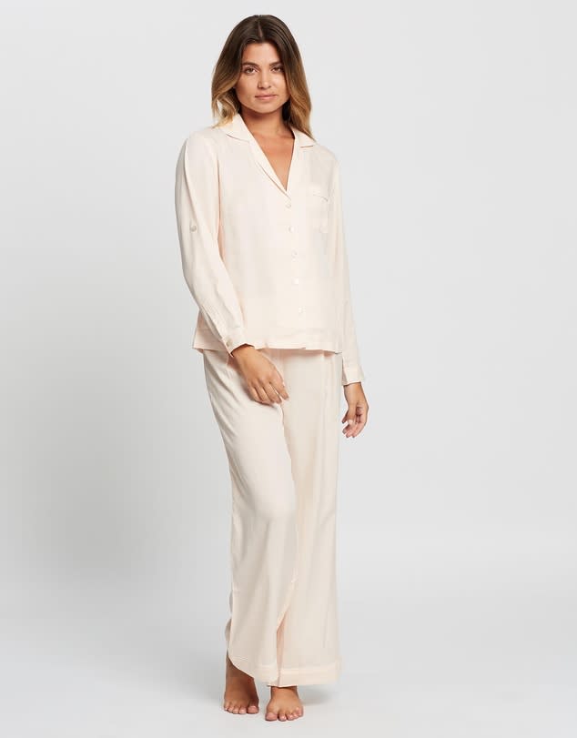 A model standing in beige loose fitting comfort sleep wear