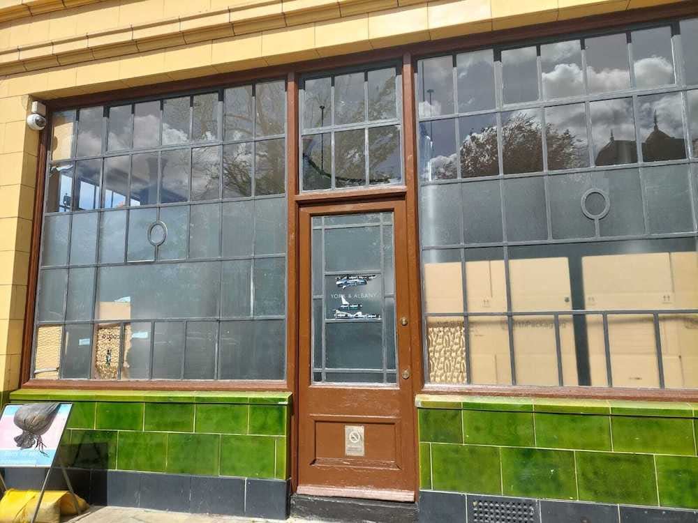 A view of the entrance to Gordon Ramsay's restaurant and hotel York & Albany, London, with boards blocking some of the windows, as squatters occupy it on April 15, 2024.