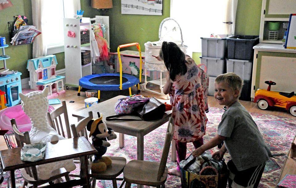 Charlotte Whinting and her brother Liam, age 4, prepare to spend time in their playroom.
