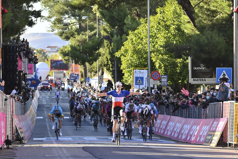 France's Arnaud Demare celebrates crossing the finish line to win the sixth stage of the Giro d'Italia cycling race, from Castrovillari to Matera, southern Italy, Thursday, Oct. 8, 2020. (Gian Mattia D'Alberto/LaPresse via AP)