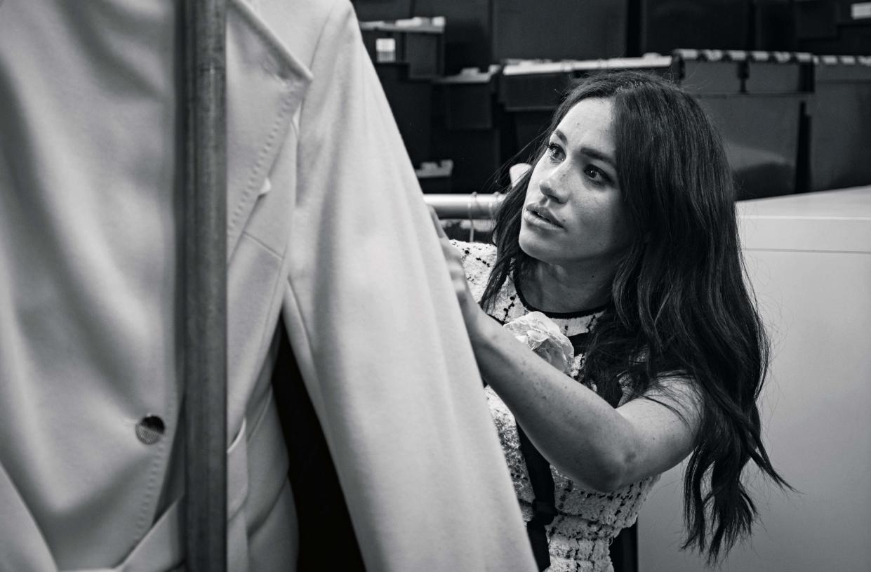 The Duchess of Sussex in the workroom of the Smart Works London office putting together the September issue of British Vogue. [Photo: @SussexRoyal/PA Wire] 