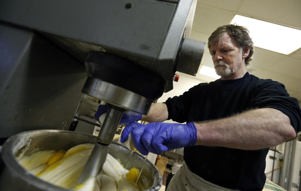 FILE - In this March 10, 2014 file photo, Masterpiece Cakeshop owner Jack Phillips cracks eggs into a cake batter mixer inside his store in Lakewood, Colo. Phillips, whose refusal to design a wedding cake for a same sex couple led to landmark Supreme Court ruling, has a book deal. Phillips' memoir, currently untitled, will be released this summer by Salem Books Publishing. (AP Photo/Brennan Linsley, File)