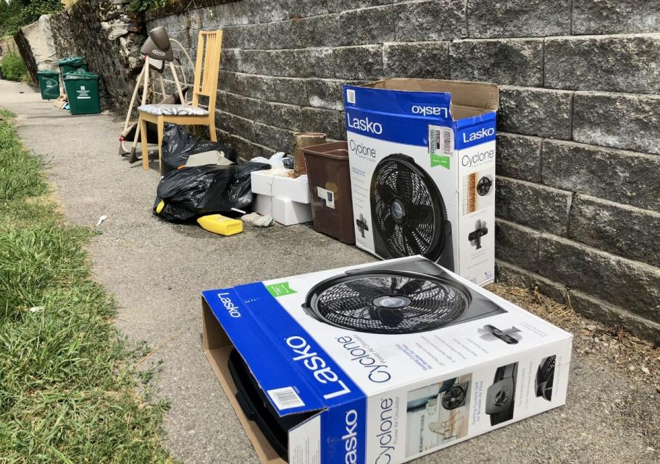 Empty cardboard boxes from recently purchased fans laid out on sidewalks in Worcester's Vernon Hill neighborhood Wednesday.