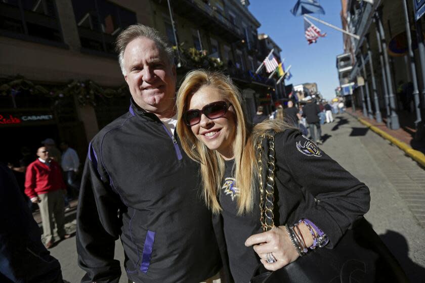 Sean and Leigh Anne Tuohy stand on a street in New Orleans, Feb. 1, 2013.