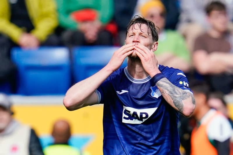 Hoffenheim's Wout Weghorst celebrates scoring his side's first goal during the German Bundesliga soccer match between TSG 1899 Hoffenheim and Borussia Monchengladbach at PreZero Arena. Uwe Anspach/dpa