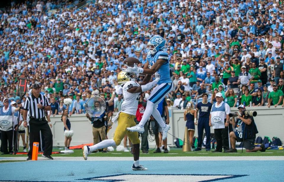 North Carolina’s Josh Downs (11) scores on a four yard pass from quarterback Drake Maye to give the Tar Heels’ a 7-0 lead in the first quarter against Notre Dame on Saturday, September 24, 2022 at Kenan Stadium in Chapel Hill, N.C.