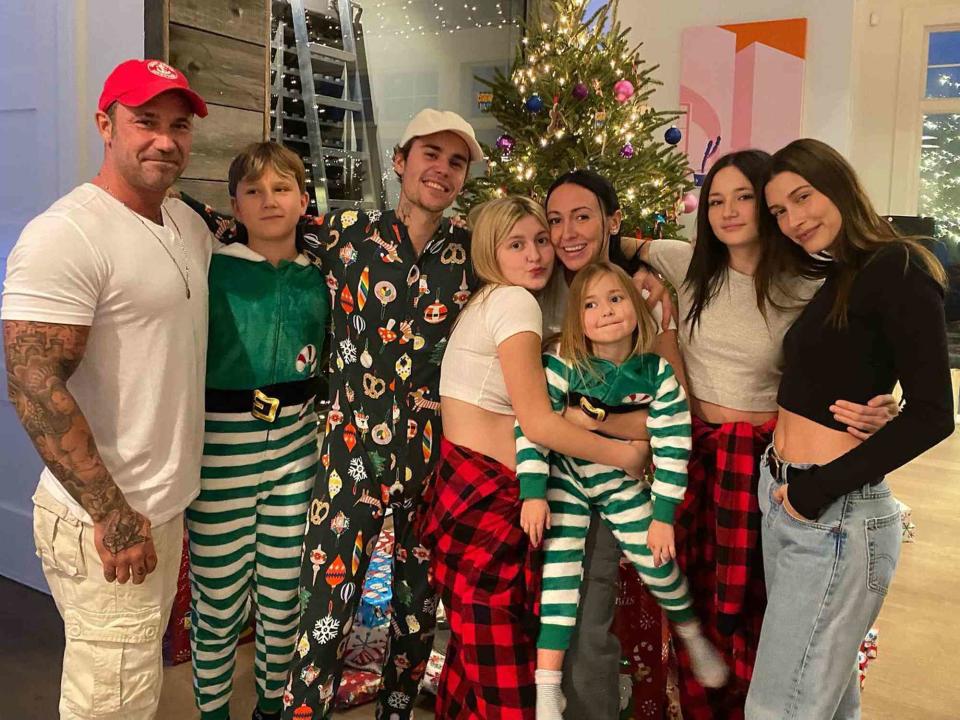 Jeremy Bieber Instagram Justin Bieber and his family posing in front of a Christmas tree