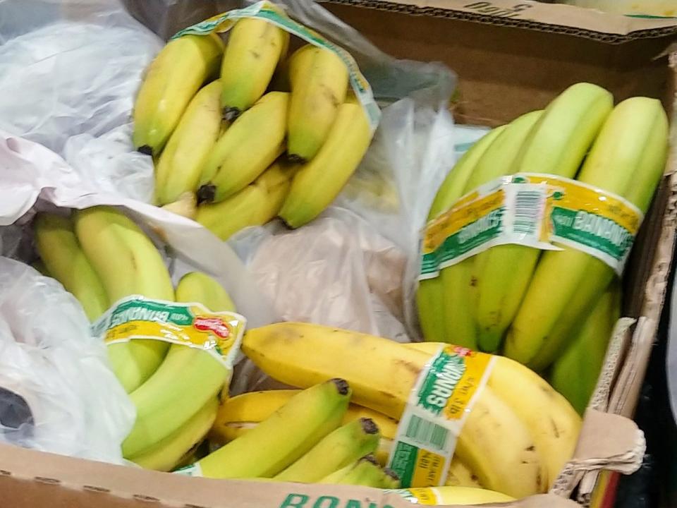 Bunches of bananas in a cardboard box at Costco