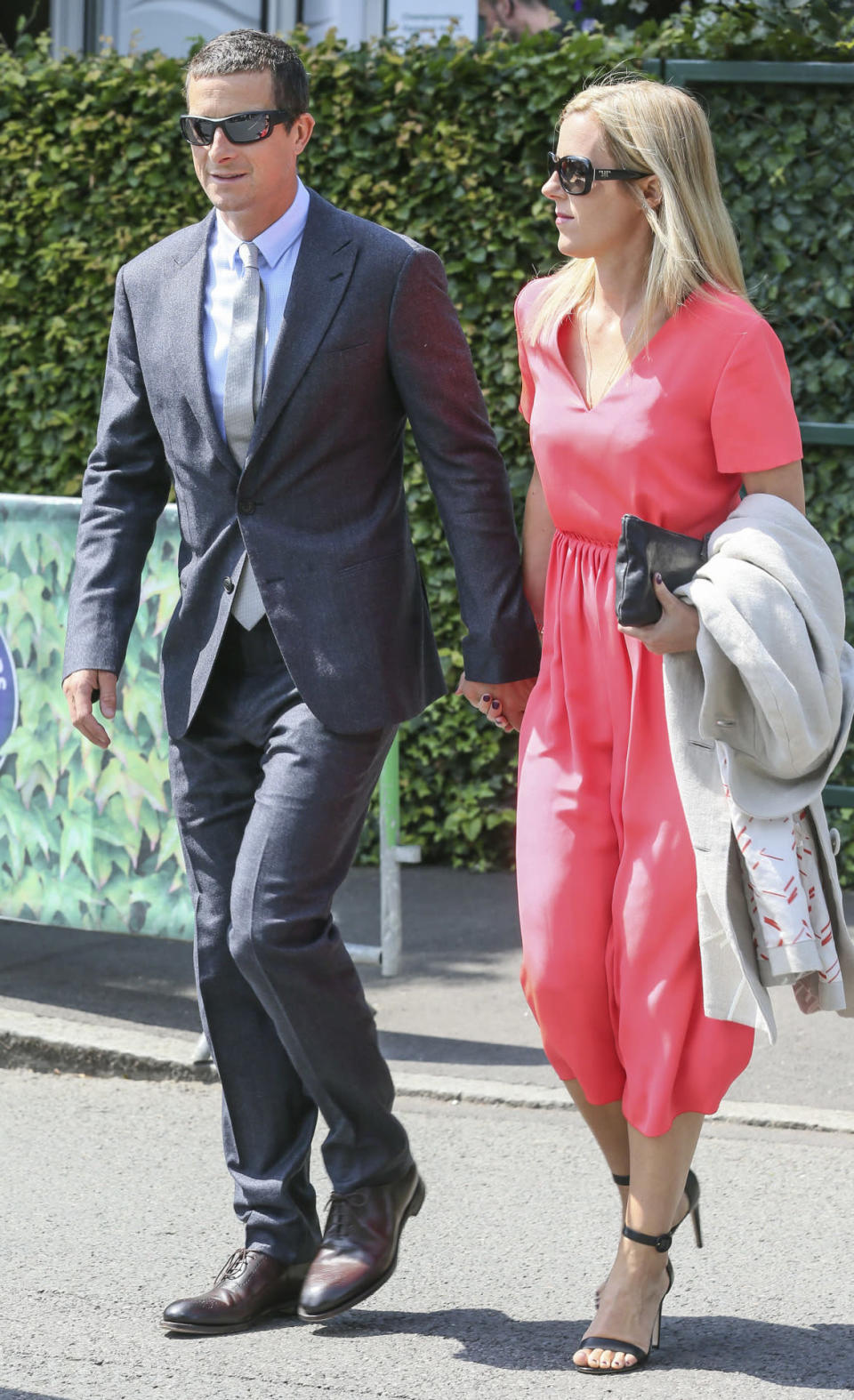<p>Bear and his wife definitely picked one of the better days to take in a match at Wimbledon. The sun shone down on the pair as they mad their way into the grounds. <i>[Photo: Rex]</i></p>