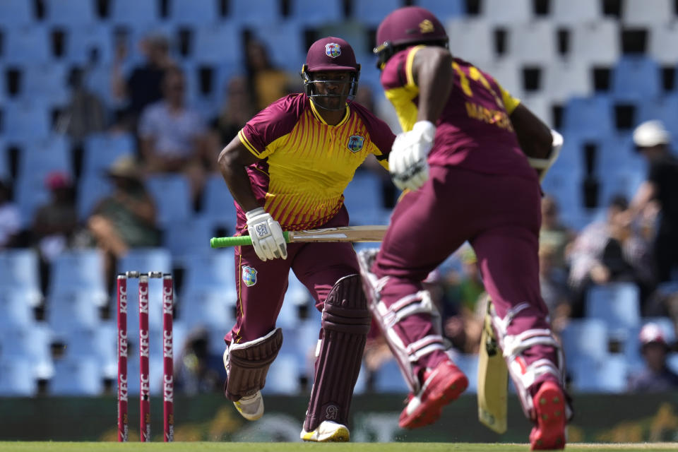 West Indies's batsman Johnson Charles with teammate runs between the wickets during the second T20 cricket match between South Africa and West Indies, at Centurion Park, in Pretoria, South Africa, Sunday, March 26, 2023. (AP Photo/Themba Hadebe)