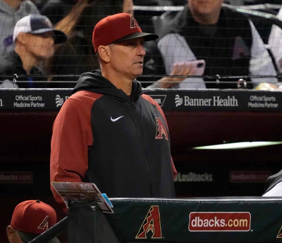 Apr 12, 2022; Phoenix, Ariz., U.S.;  Arizona Diamondbacks manager Torey Lovullo (17) watches his team play against the Houston Astros during the fifth inning at Chase Field.