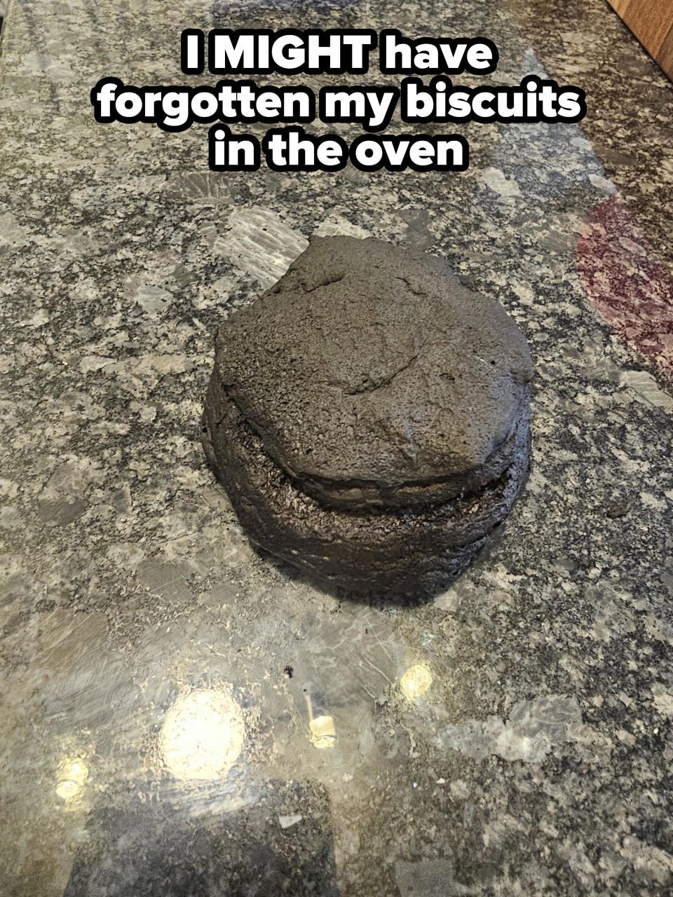 Burnt round cake on a granite countertop