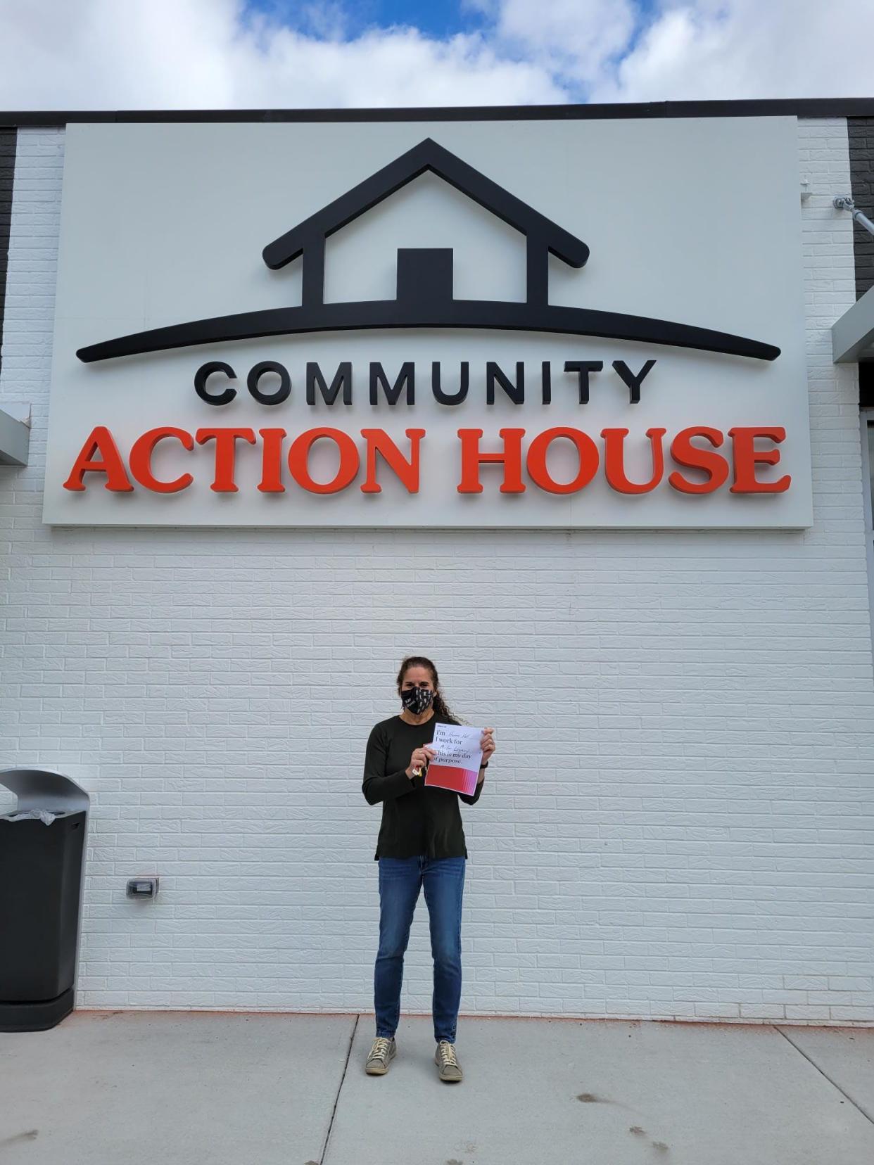 A volunteer from MillerKnoll offers her services at Community Action House in Holland as part of the company's Global Day of Purpose on Tuesday, Nov. 2.