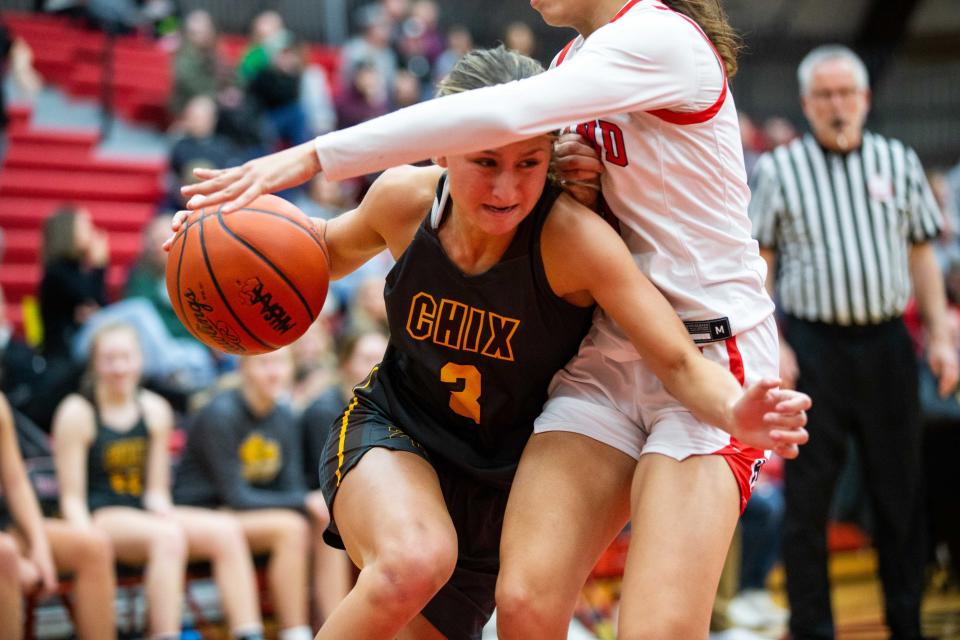 East's Rachel Miller drives past her Holland defender on her way to the basket Friday, Feb. 10, 2023, at Holland High School. 