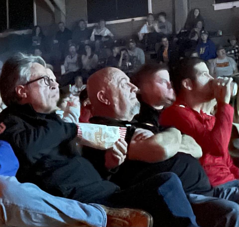 "Hoosiers" writer Angelo Pizzo (left) sits next to Bob Garner as they watched the never-before-seen version of the movie at the Hoosier Gym in Knightstown Saturday, Nov. 13, 2021.