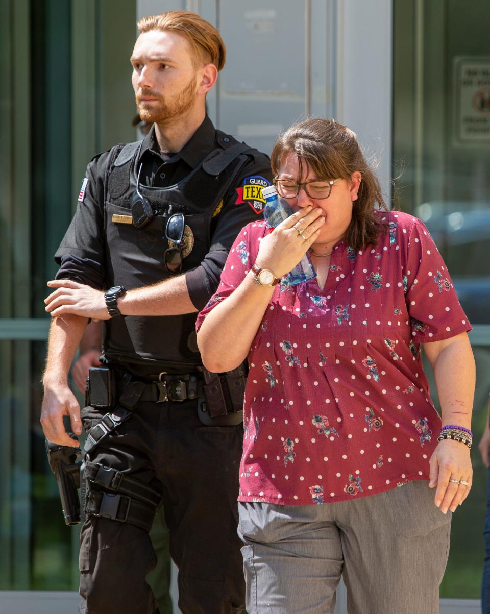 A woman cries as she leave the Uvalde Civic Center following a shooting earlier in the day at Robb Elementary School, Tuesday, May 24, 2022, in Uvalde, Texas. 