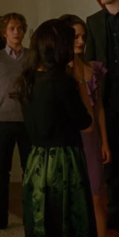 Bella wearing flats, a dress, and a cardigan