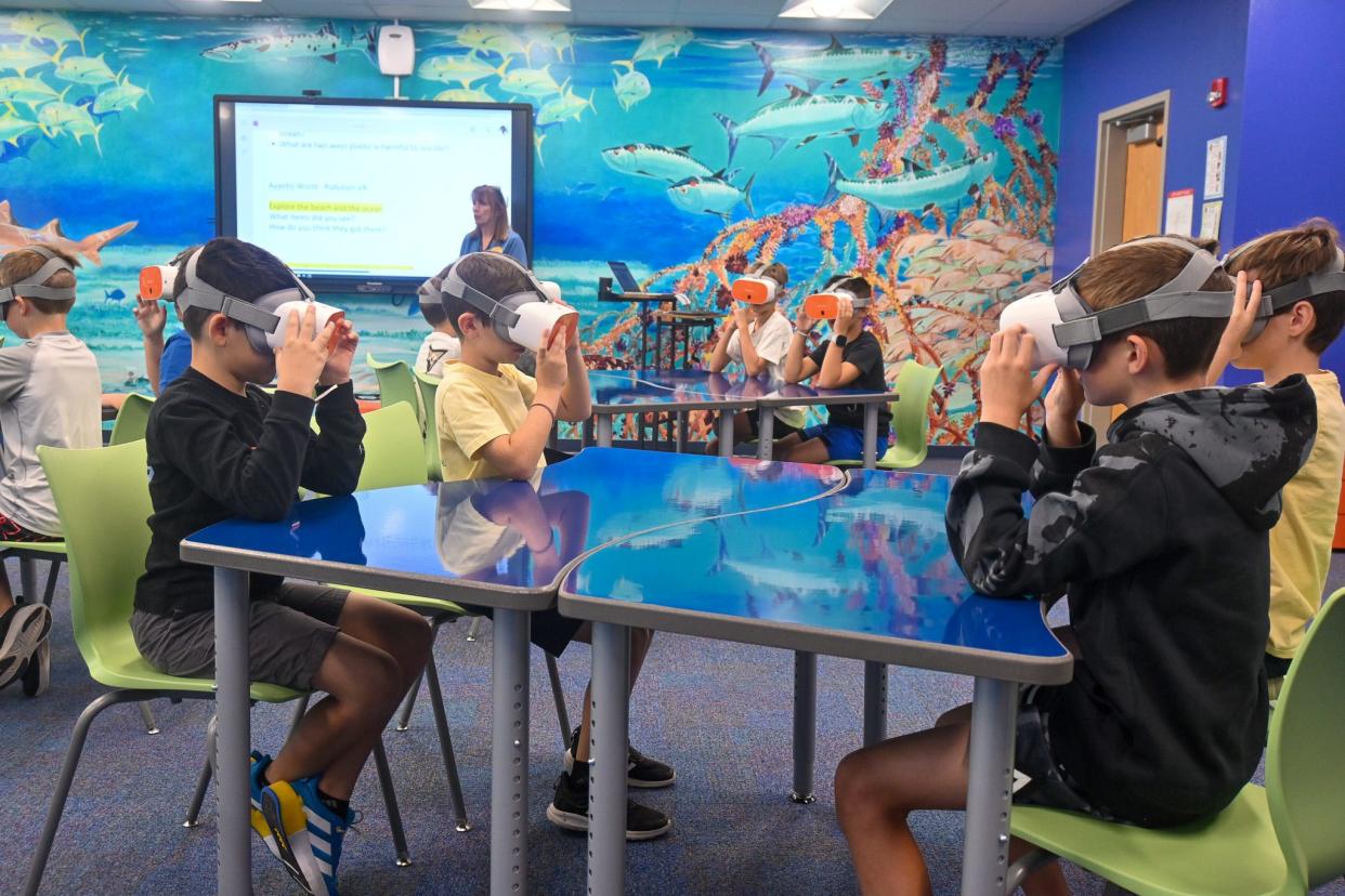 A specialized classroom at Guy Harvey Academy of Arts & Sciences, designed and funded by the Guy Harvey Foundation, features Guy Harvey’s artwork, virtual reality goggles, and state of the art technology.