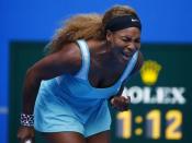 Serena Williams of the U.S. reacts after winning a point during her women's singles match against Silvia Soler-Espinosa of Spain at the China Open tennis tournament in Beijing September 29, 2014. REUTERS/Petar Kujundzic