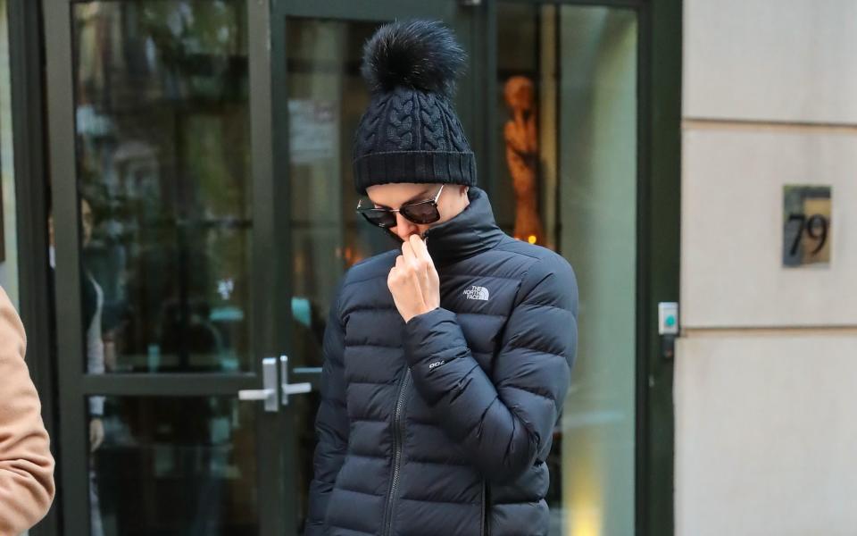 Charlize Theron wearing a North Face jacket - Getty