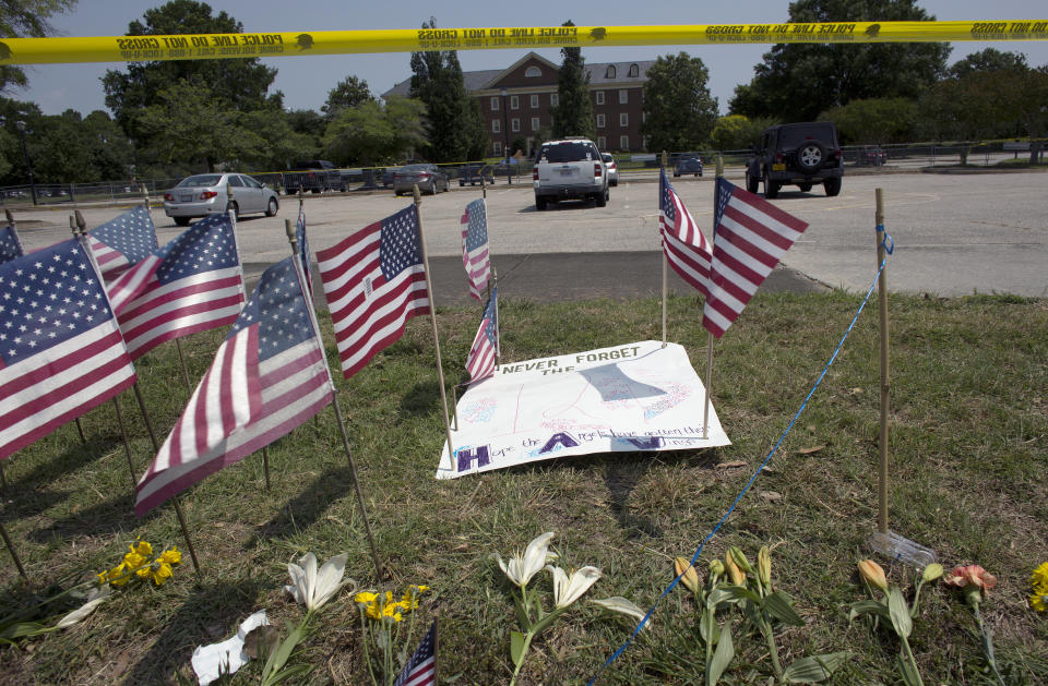 FILE - This June 3, 2019 file photo, shows a memorial site on George Mason Dr. honors the victims killed during a mass shooting that took place on May 31, 2019 at the Virginia Beach Municipal Center in Virginia Beach, Va. A state commission tasked with investigating the 2019 mass shooting in Virginia Beach has called for numerous changes to how Virginia and its communities respond to mass shootings. (L. Todd Spencer/The Virginian-Pilot via AP, File)