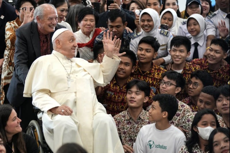 Pope Francis interacts with young people of Scholas Occurrentes at Grha Pemuda Youth Center in Jakarta, Indonesia, on Wednesday. The pontiff is on a 11-day trip to the Asia-Pacific region, which includes stops in Papua New Guinea, East Timor, and Singapore. Photo by Tatan Syuflania/EPA-EFE/pool