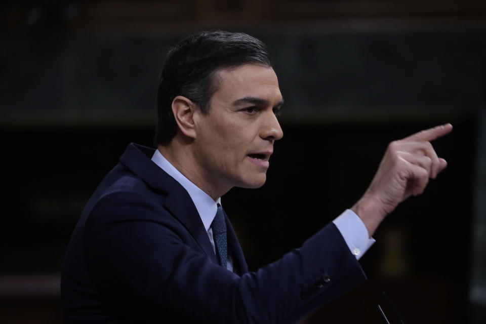 Spain's interim Prime Minister Pedro Sanchez speaks at the Spanish Parliament in Madrid, Spain, Sunday, Jan. 5, 2020. Sanchez is facing the first of two opportunities Sunday to win the endorsement of the Spanish Parliament to form a left-wing coalition government. It would be Spain's first coalition government since the return of democracy following the death of dictator Francisco Franco in 1975. (AP Photo/Manu Fernandez)