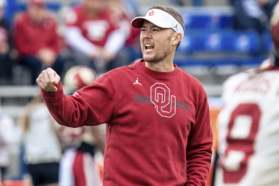 LAWRENCE, KS - OCTOBER 23: Head coach Lincoln Riley of the Oklahoma Sooners talks to players during warmups before a game against the Kansas Jayhawks at David Booth Kansas Memorial Stadium on October 23, 2021 in Lawrence, Kansas. (Photo by Kyle Rivas/Getty Images)