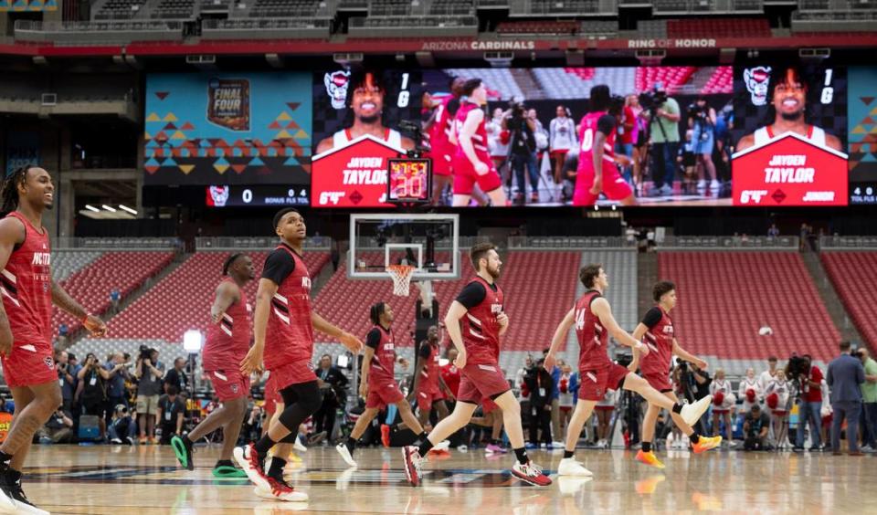 N.C. State’s Casey Morsell (14) and his teammates stretch during their open practice on Friday, April 5, 2024, as they prepare for their NCAA National Semi-Final game against Purdue at State Farm Stadium in Glendale, AZ.