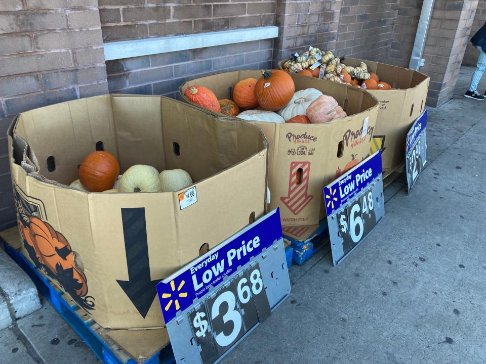 Decorative gourds for sale outside a Walmart store.