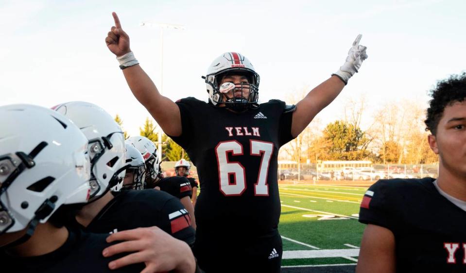 Yelm senior lineman Kolby Henry celebrates with teammates following the Tornados’ 36-27 victory over the Kennewick Lions in Saturday afternoon’s 3A football state quarterfinal game at Yelm High School in Yelm, Washington, Nov. 19, 2022.